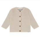Knitted cream baby cardigan with buttons on a white background