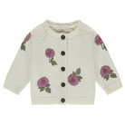 Knitted cardigan with rose patterns on a white background