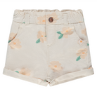 Denim shorts with floral pattern and gold button on a white background