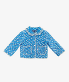 Blue quilted jacket with white floral pattern on a light gray background