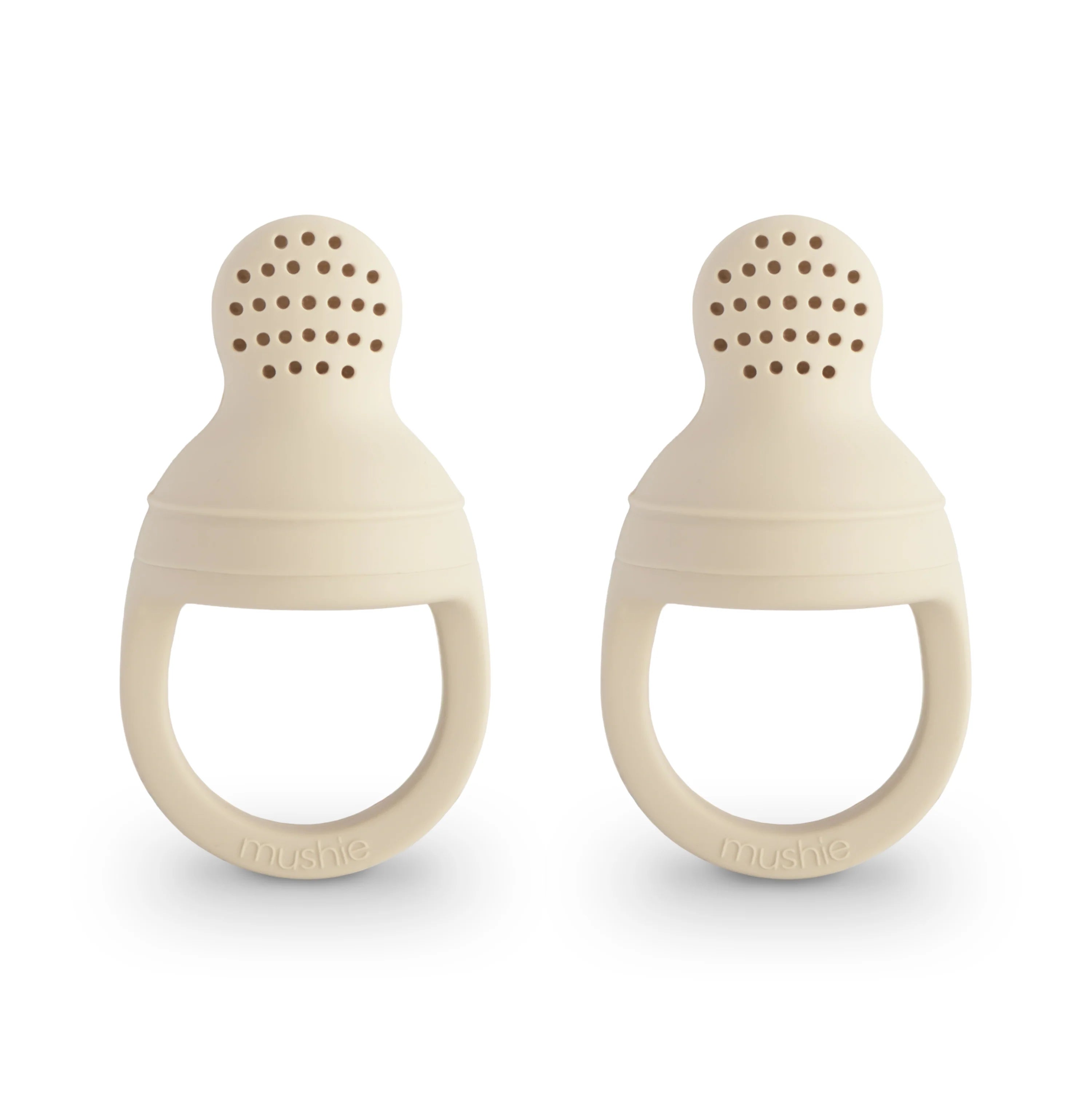 Two beige silicone baby teething rings on a white background