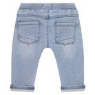 Back view of light blue denim jeans on a white background