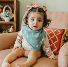 baby wearing cactus print bandana bib 