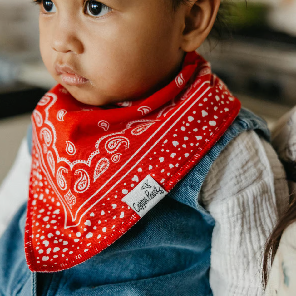 baby wearing red bandana bib