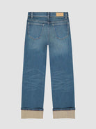 back of DL blue jeans with cuffed bottoms 