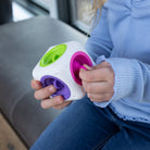 Toddler using Tugl Cube to develop fine motor skills