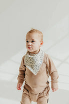bandana bib with dino footprint pattern 