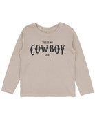 Beige long-sleeve shirt with 'This is my cowboy shirt' text on a white background