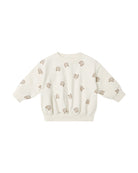 beige crewneck sweatshirt with bear pattern 