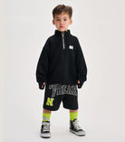 child wearing a black sweatshirt with white background