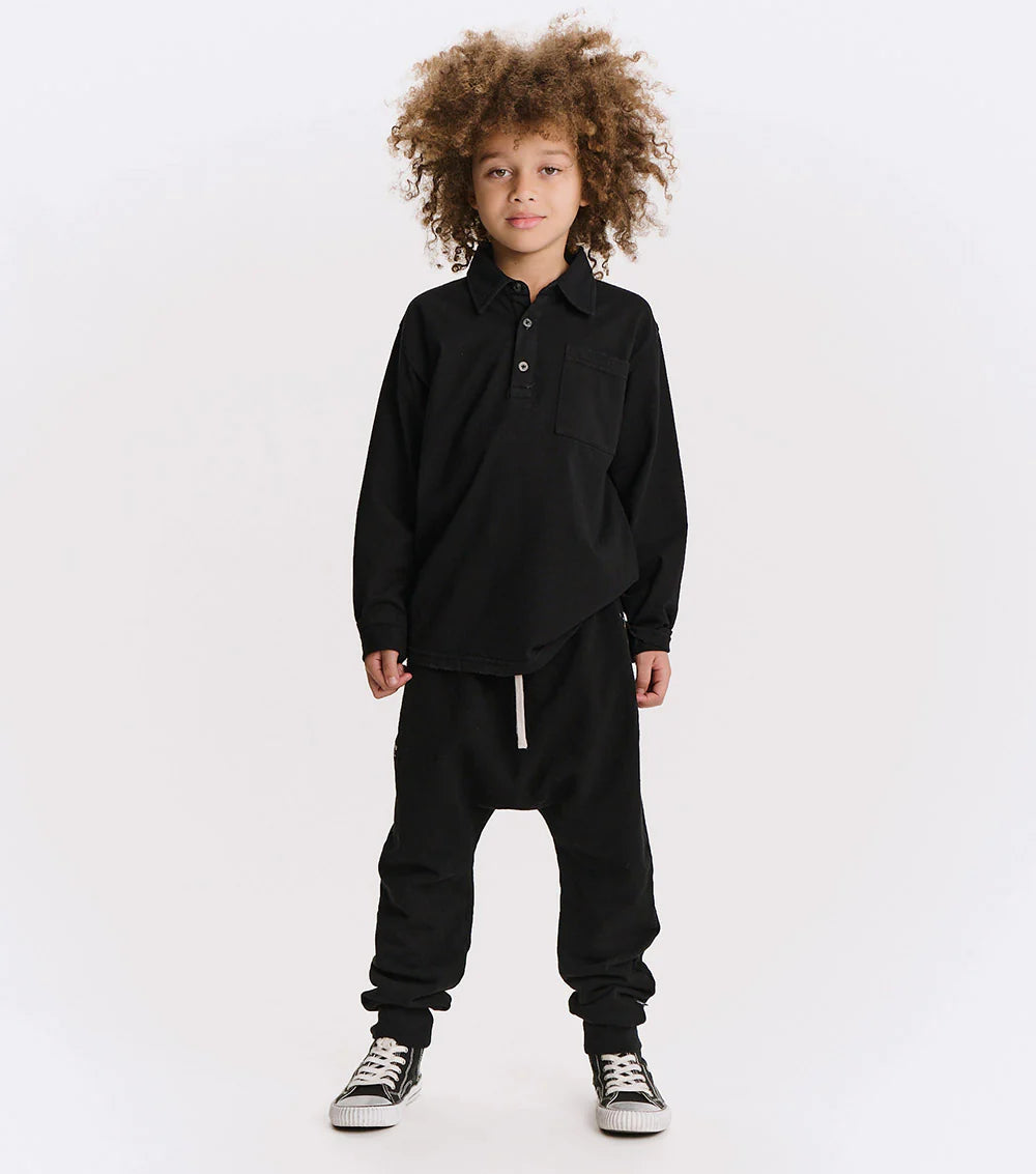 Child wearing a black outfit on a white background