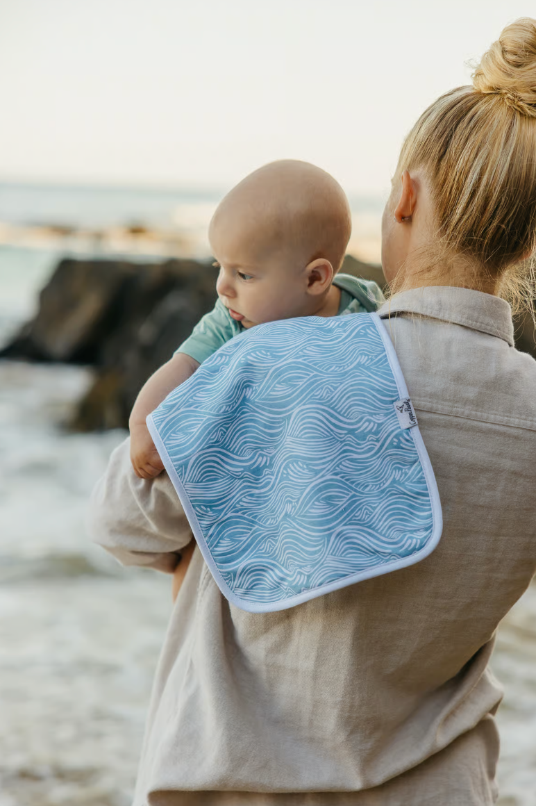 blue burp cloth with ocean waves 