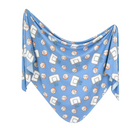 A blue knit swaddle blanket with a geometric pattern featuring basketballs, likely designed for infant swaddling.