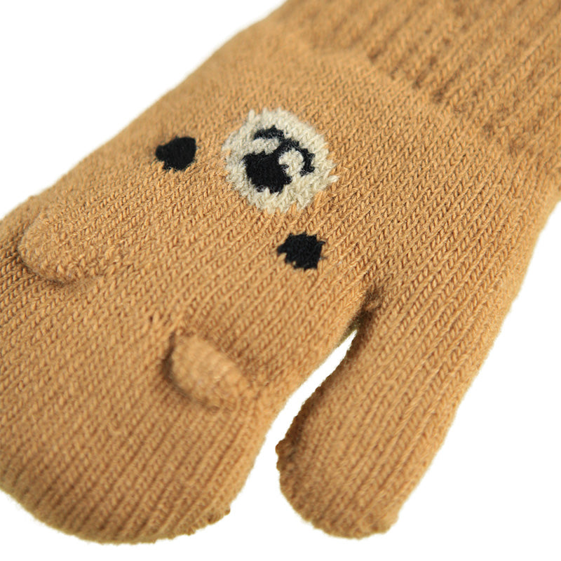 Brown knitted glove with a dog face design on a white background