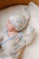 copper pearl hat for babies with blue bows 