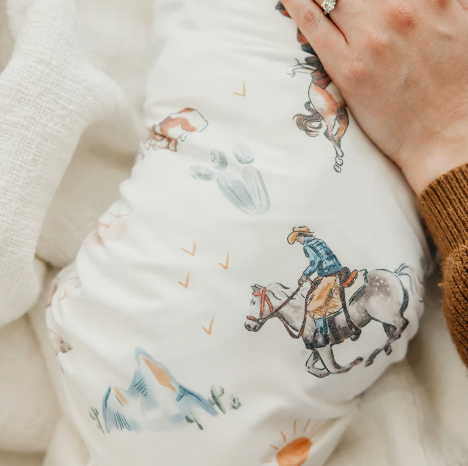 cowboy on a horse swaddle