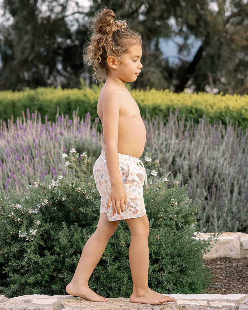 cream swimshorts with ocean prints 