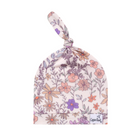 A floral patterned baby top knot hat by Copper Pearl, featuring a knot on the top and an adjustable tie.