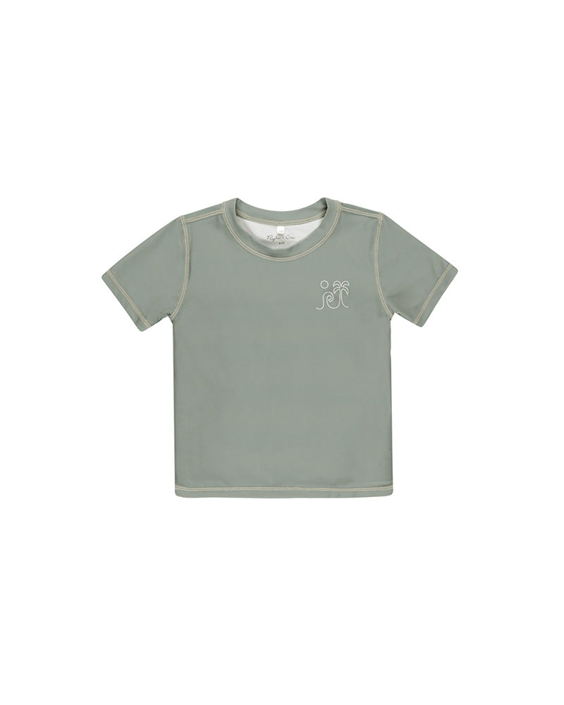 green swim shirt with waves 