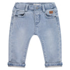 Light blue denim baby pants on a white background