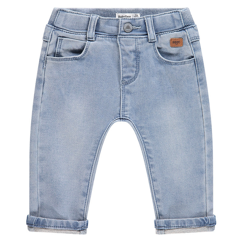 Light blue denim baby pants on a white background