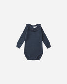 Navy blue baby bodysuit with ruffled neckline on a white background