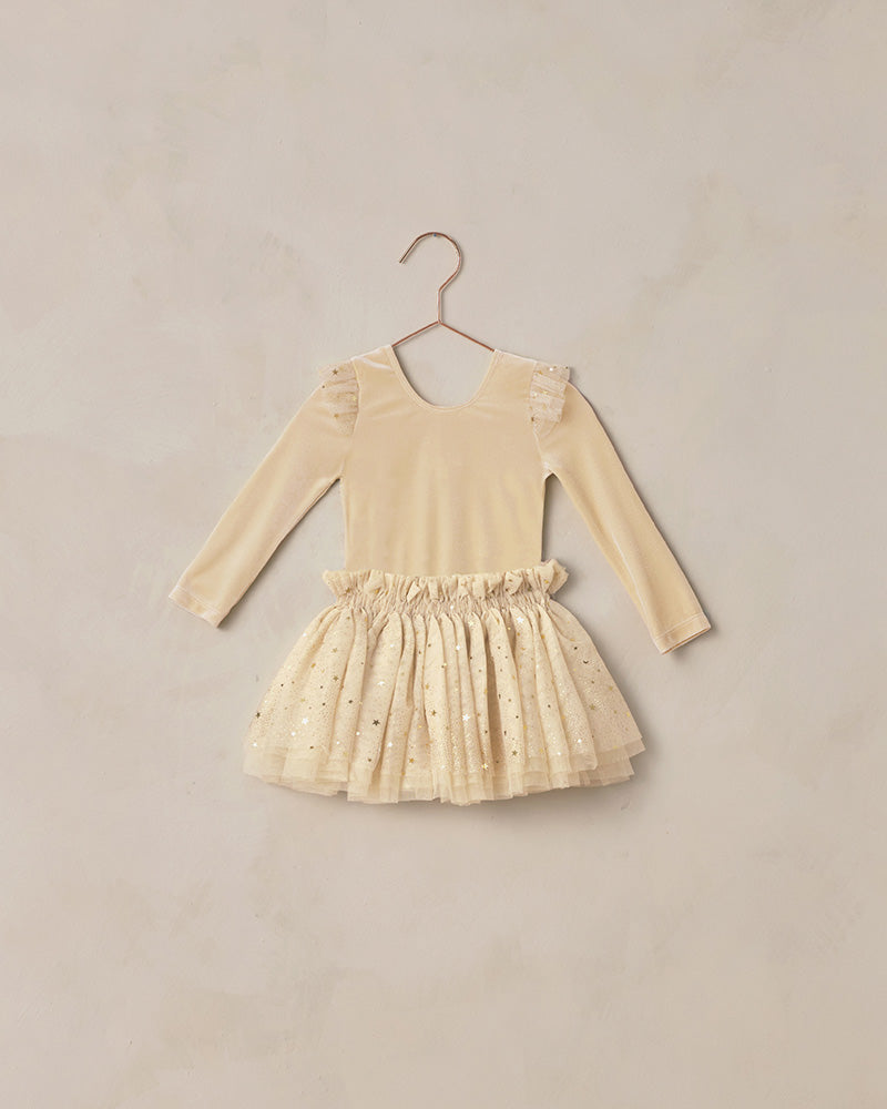 Beige leotard with long sleeves and a double-tiered glitter tutu.
