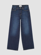 Pair of blue wide leg jeans on a light gray background