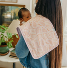 paisley burp cloth over woman's shoulder holding a baby