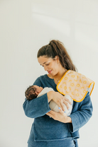 pink burp cloth with orange fruit pattern 