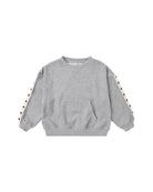 A light gray heather crewneck sweatshirt with a front kangaroo pocket and decorative white stripes on the sleeves featuring small red star details, shown on a plain white background.