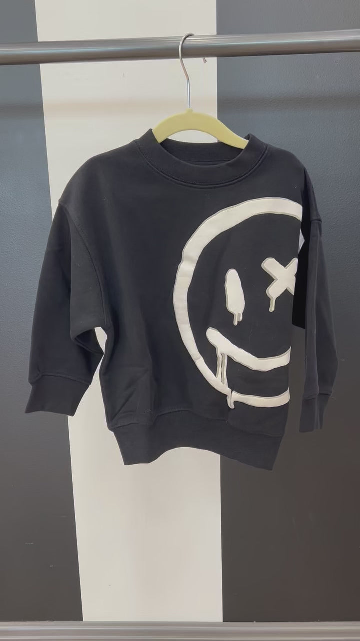 Video of Black Crewneck with Big White Smiley Face 