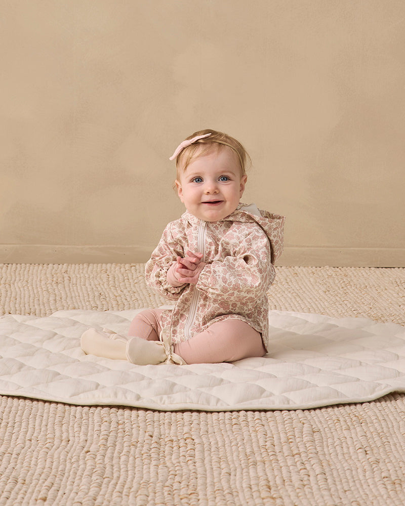 A hooded zip-up jacket with a pink and beige leopard print pattern, featuring a cream-colored lining inside the hood and front pockets, shown on a plain white background.