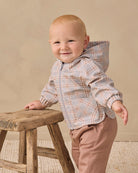 A hooded zip-up jacket for toddlers, featuring a light gray and beige plaid pattern with a light gray zipper and elasticized cuffs, shown against a plain white background.