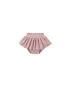 Pink ruffle baby bloomers on a white background