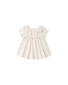 Pink floral dress on a white background