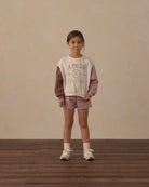 Multicolor crewneck sweatshirt with 'Apres Ski Club' text on a white background