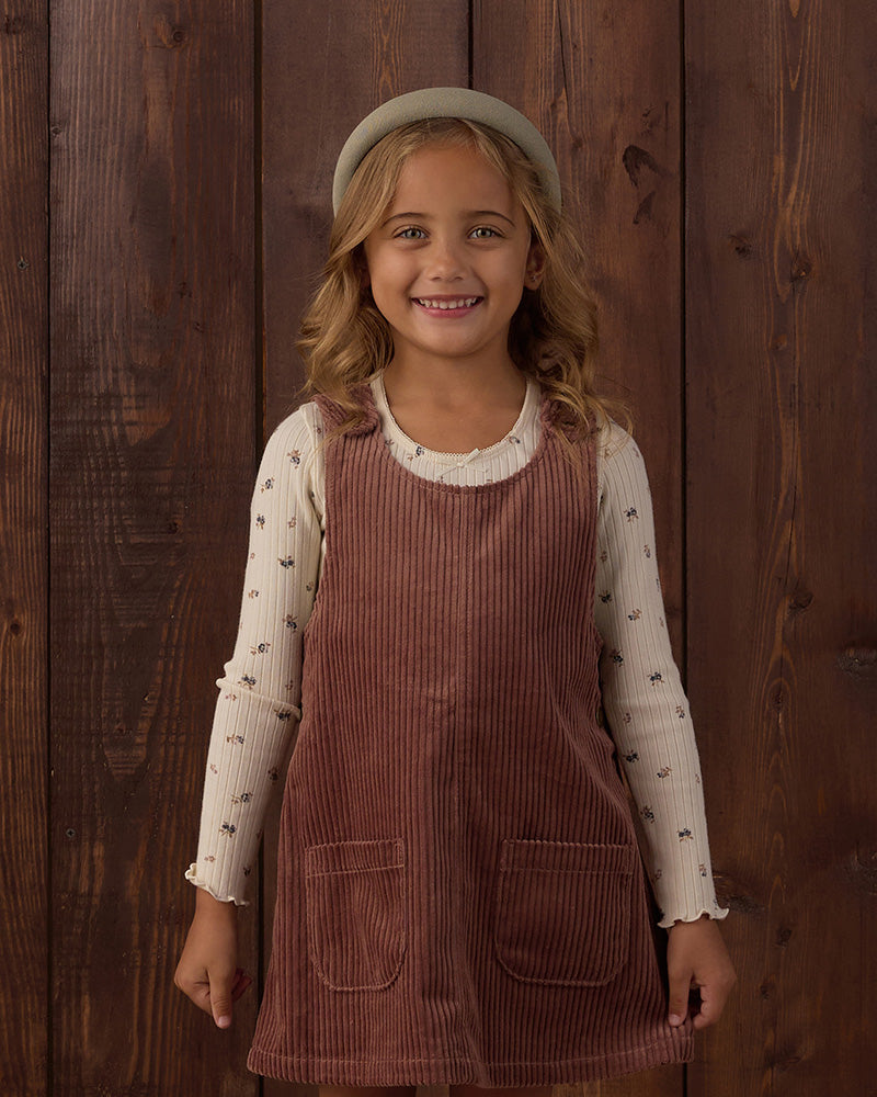 Brown corduroy pinafore dress with buttons and front pockets 
