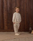 White sweatpants with brown porcupine pattern and a drawstring on a white background
