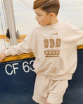 Load image into Gallery viewer, Kids Cream Relaxed Shorts
