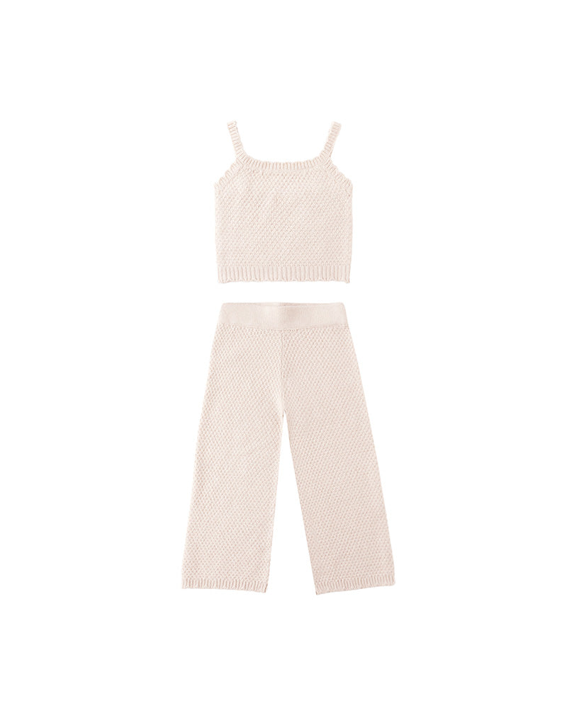 Knitted tank top and wide-leg pants set on a white background