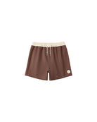 Brown shorts with a beige waistband on a white background