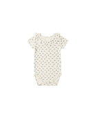 Baby romper with a subtle floral pattern on a white background