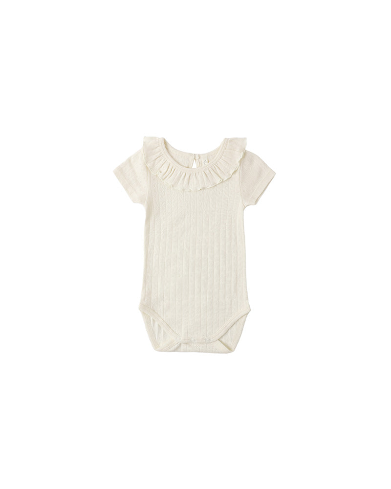 Baby onesie with ruffled collar on a white background