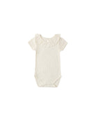 Baby onesie with ruffled collar on a white background