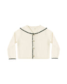 White cardigan with black trim and a fold-over collar on a white background