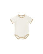 White baby bodysuit with beige trim on a white background