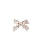 Floral bow hair accessory on a white background