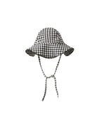 Black and white checkered bucket hat with a scalloped trim on a white background