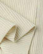 Close-up of beige ribbed fabric with a soft texture